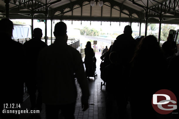 A bad picture, but you can sort of tell the rail/divider for the walkway at the Monorail exit at the Magic Kingdom is partially removed now.