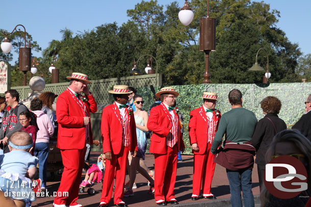 The Dapper Dans performing on Main Street USA in their holiday finest.