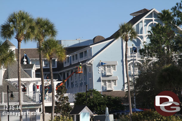 A crew cleaning the Beach Club with high pressure water