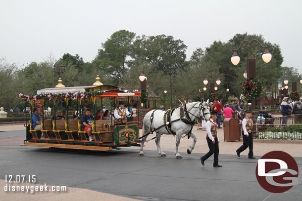 A horse drawn street car making the rounds.