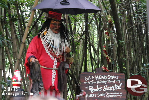 A holiday inspired sign with Trader Santa.