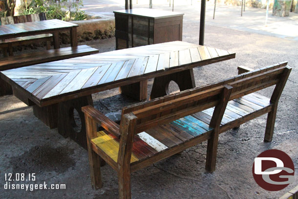 A variety of benches and chairs in the seating area.