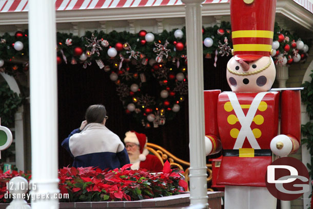 Santa greeting guests in Town Square.