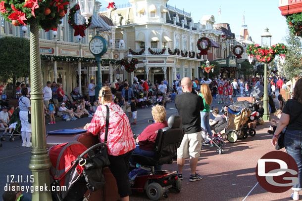 A small crowd gathered for the Festival of Fantasy Parade.  It was just after 3pm (the clock was off by a couple minutes) and the parade had just stepped off in Frontierland, but still plenty of space on Main Street USA.