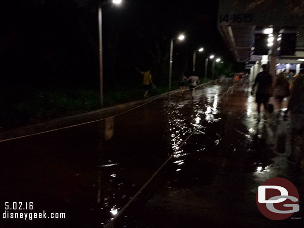 The queue for Pop Century had a mini lake too.  so I used the one next to it and crossed the ropes after the puddle.  There was a cast member here directing people to the buses.  He was unconcerned with the water.