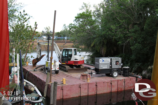 A work barge docked near Asia.