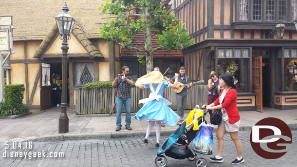 Alice dancing her way up the street.