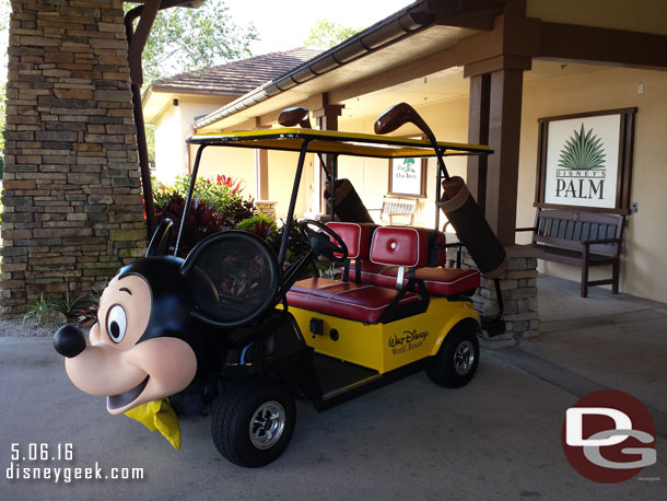 Waiting for a cab, the Mickey golf cart was parked at the clubhouse entrance.