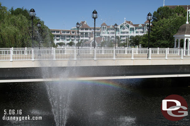 Passed a rainbow created by the fountain spray.