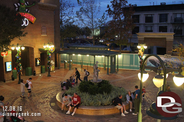 A view of the courtyard at night from the balcony/patio seating.