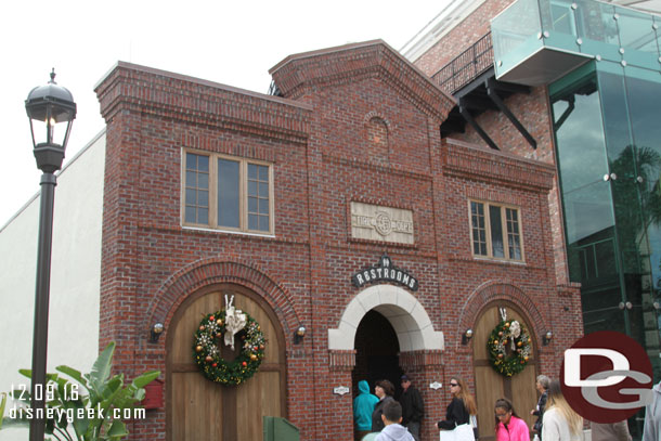 The restroom building has the facade of a firehouse.