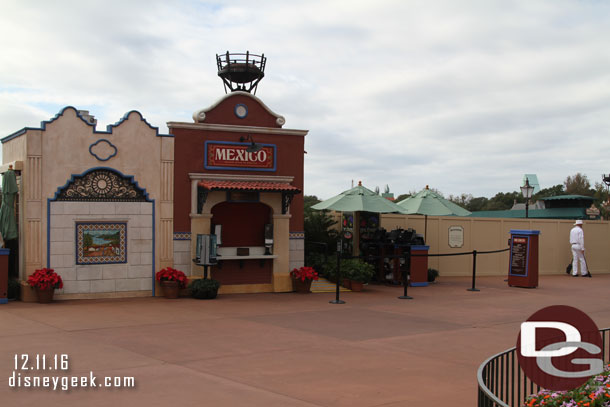 Walls and marketplaces block the view of World Showcase Lagoon.