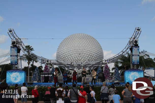 The American Music Machine performing a Christmas set on the Fountain of Nations Stage