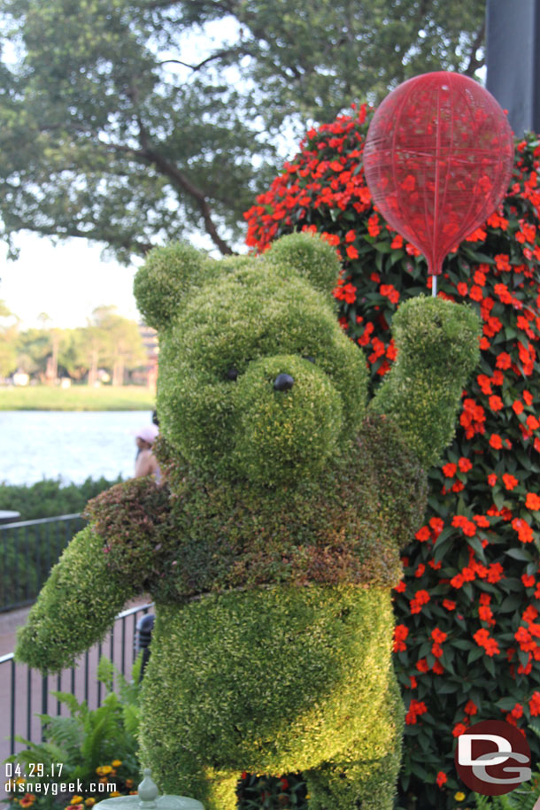 Winnie the Pooh in a planter near the United Kingdom.