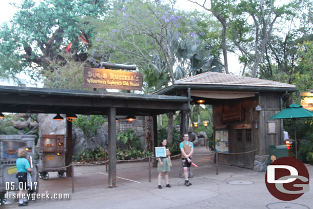 Cast members with signs to help direct guests to the proper area for Rivers of Light.