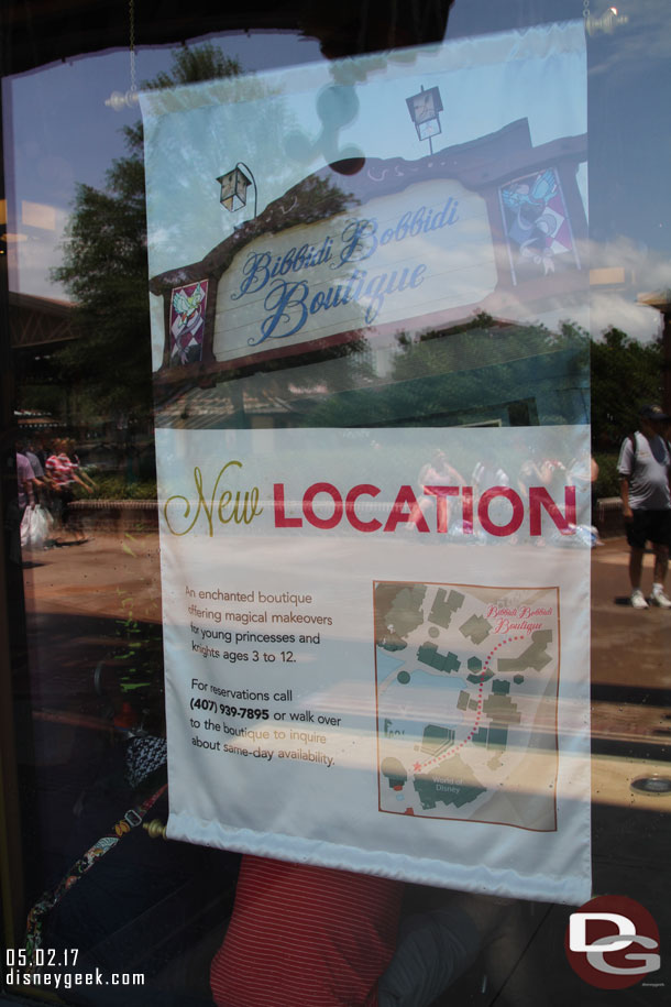 The Boutique has moved, a sign in the World of Disney window.