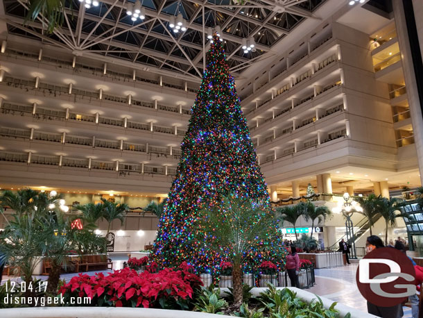 A large Christmas tree in the center of the airport.
