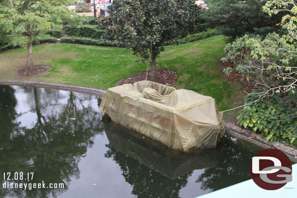 A pontoon boat in one of the waterways off the hub.  Assuming for the work in Adventureland.