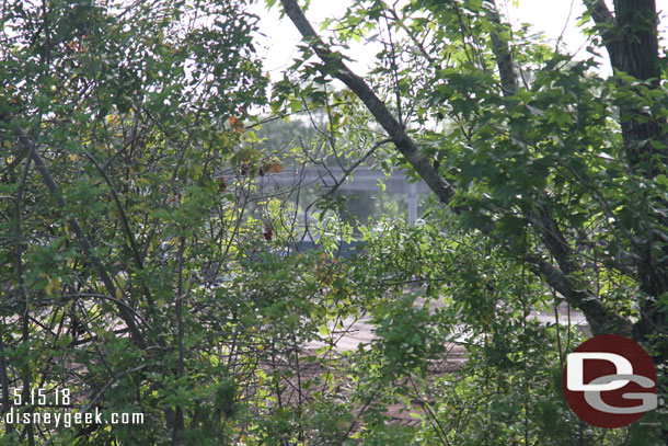 Through the trees you can sort of make out the clearing and see the monorail spur line in the distance.