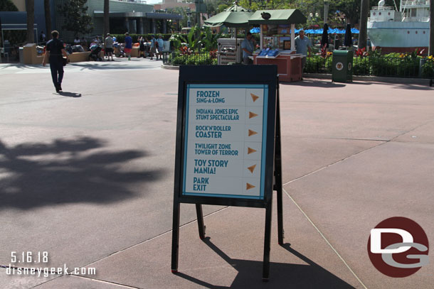 Signs up to direct you around some concrete work near Frozen's theater.