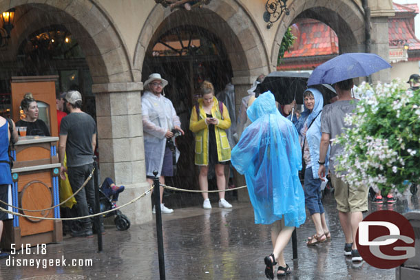 Thought this PhotoPass moment was funny..  the photographer was standing under cover and guests would go out in the rain to have their picture taken.