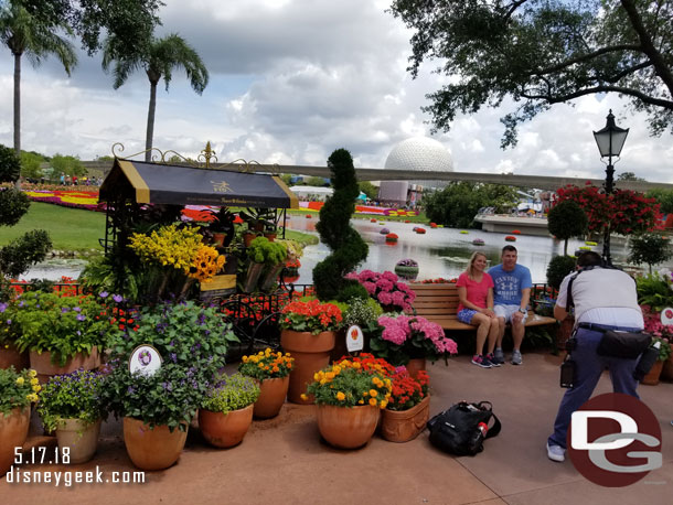 Several potted plants this year along the walkway.  Forming a Photopass photo op here.