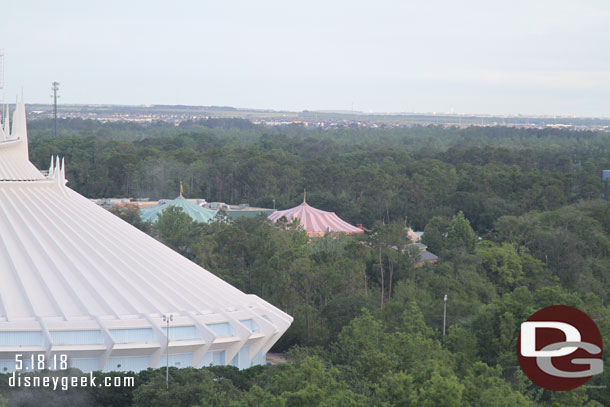 To the left you can see the tents for the Storybook Circus area beyond Space Mountain.