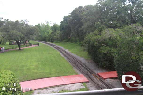 A new bright red path from backstage near Space Mountain across the train tracks and to the walkway.  (Found out after returning home this will be a new temporary exit path for Space Mountain).