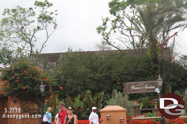 The Ratatouille Show building rising up behind the trees between Morocco and France.