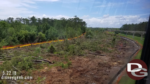 Tree clearing underway at Epcot from the Monorail beam quite a ways back then spanning out to the solar farm.