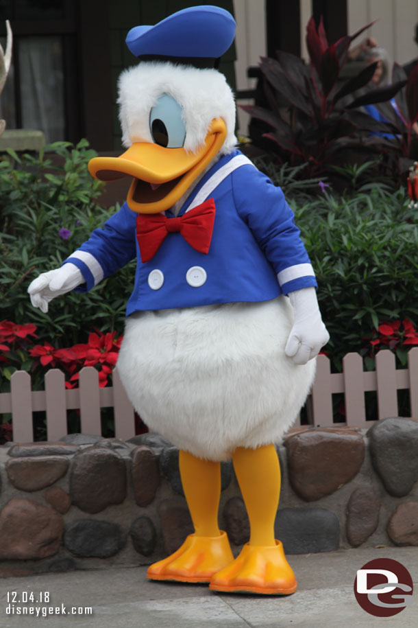 Donald Duck greeting guests near the former One of a Kind store.