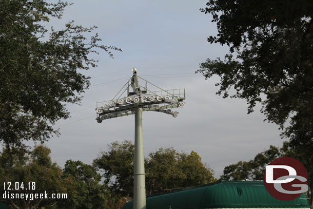 Overhead the Disney Skyliner towers dominate the area.