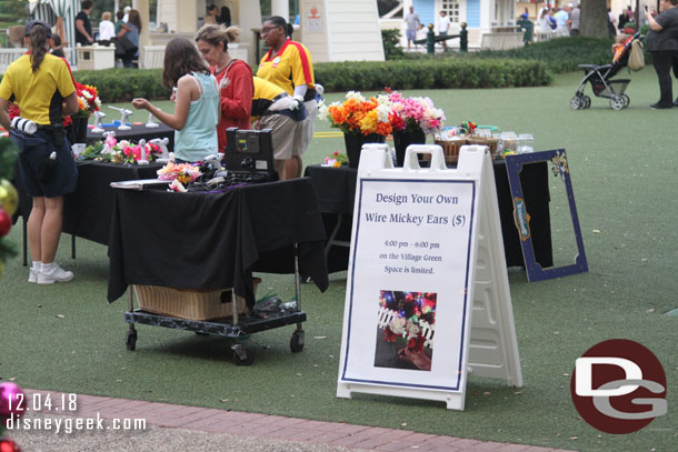 Unpacked a bit then set out again for Epcot..  on the lawn there was a Design Your Own Wire Mickey Ears activity going on.