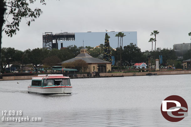 A Friendship boat on World Showcase Lagoon, the Guardians of the Galaxy show building looming in the distance.