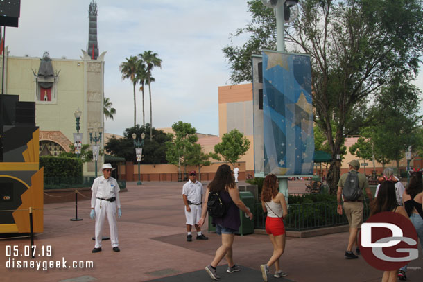 Cast Members guiding everyone through the archway.
