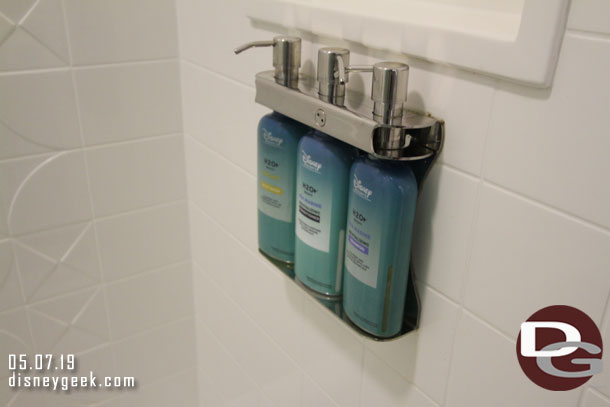 Soap and Shampoo dispensers on the wall.