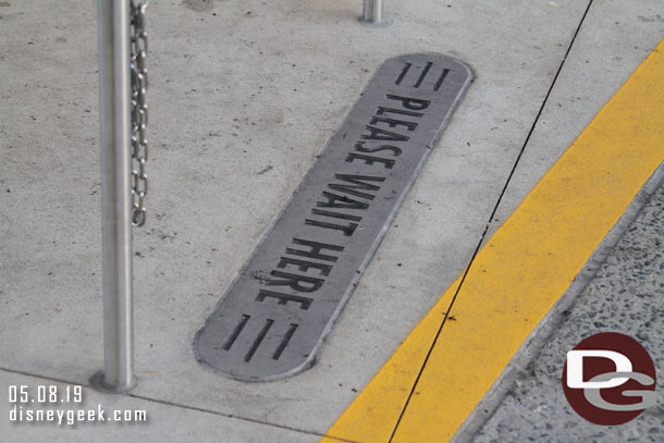 Arrived at Disney's Hollywood Studios at 7:21pm.  Noticed the bus stops have these imprinted into the concrete.