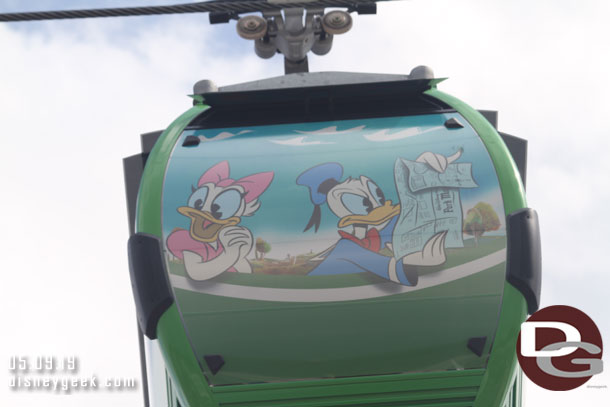 Donald trying to read the map and Daisy along for the ride.