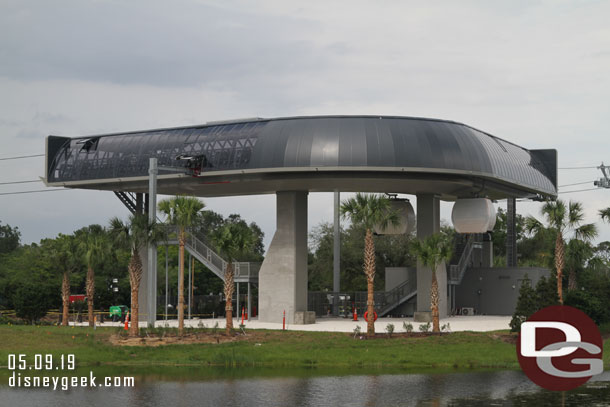 They are still finishing the area, but landscaping is in and Gondolas are passing through the turn.  there is no station here and it is an automated facility.