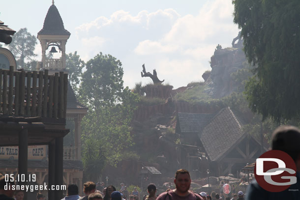 Smoke from the castle show blowing through Frontierland.