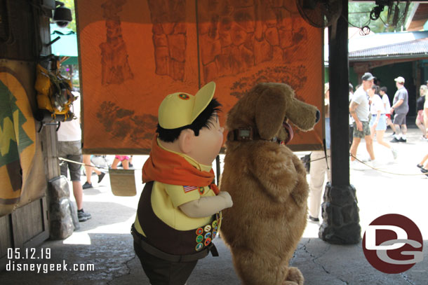 Russell and Dug greeting guests.