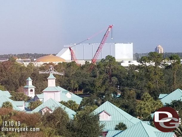 The large crane is backstage by the marina.