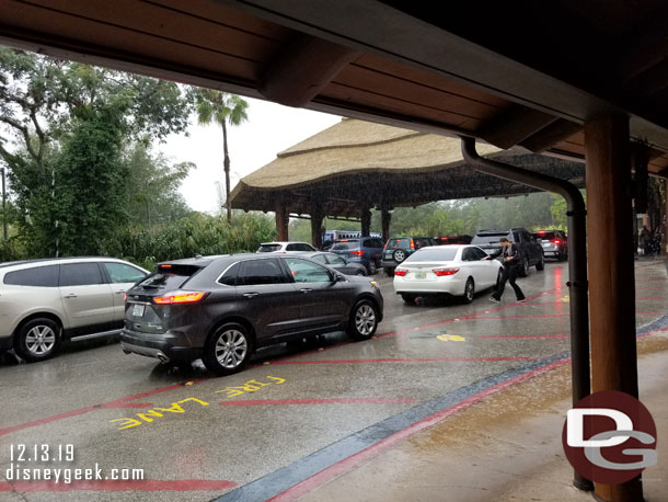 Cars backed up trying to get under cover to load/unload at the front of the resort.