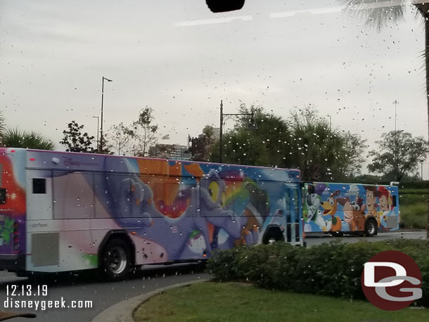 Figment bus passing a Toy Story bus.