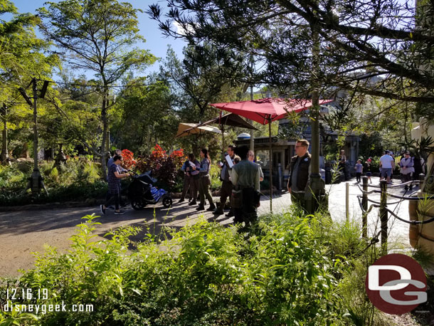 This line of Cast Members scans your Magic Band/Ticket to verify your boarding group then you can enter the queue.