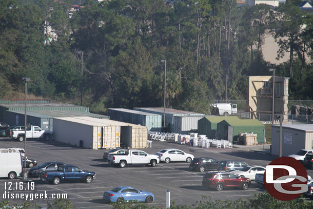 New chairs, trashcans and other items staged in a parking lot.