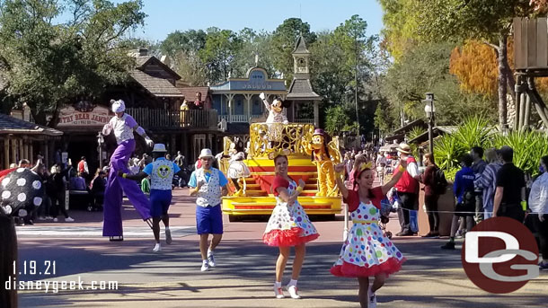 The cavalcade is led by a handful of dancers.