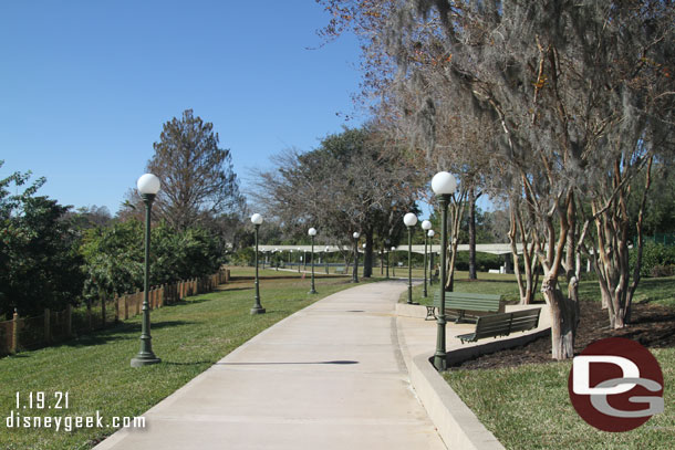 The first section of the walkway has some trees and benches.