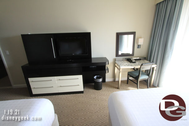 The primary difference in the two rooms is this one features a desk and the other  has a table and a window that looks down into the living room.