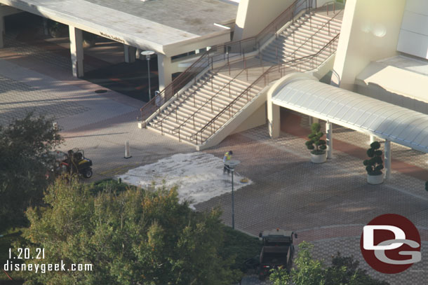 A cast member out cleaning the walkway this morning.